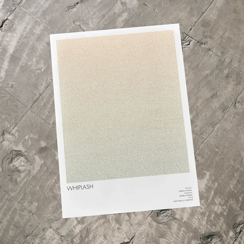 A Whiplash movie script poster laid flat on a textured floor surface.