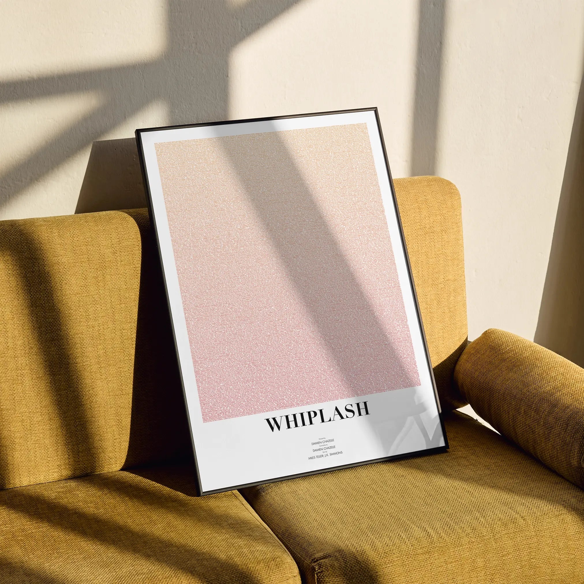 A framed Whiplash movie script poster styled in a clean interior setting.