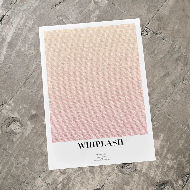 A Whiplash movie script poster laid flat on a textured floor surface.