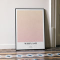 A framed Whiplash movie script poster leaning against a wall in a minimalist interior.