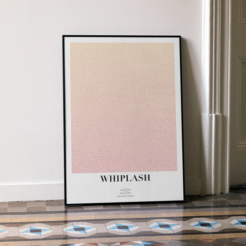 A framed Whiplash movie script poster leaning against a wall in a minimalist interior.