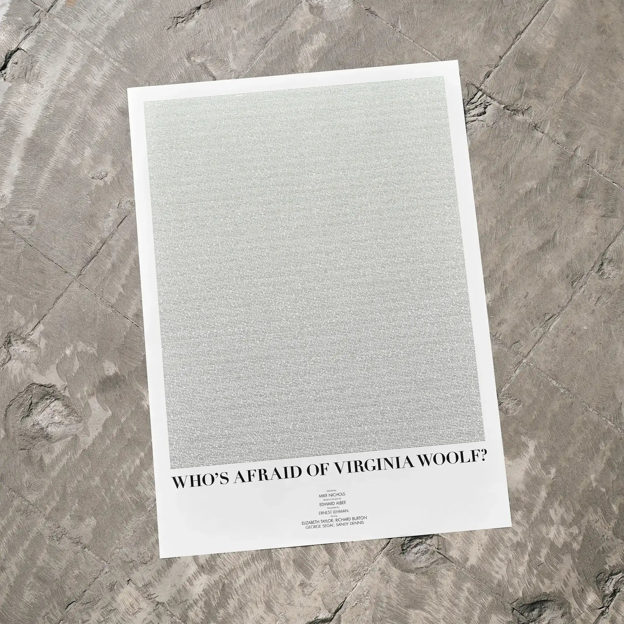 A Who's Afraid of Virginia Woolf? movie script poster laid flat on a textured floor surface.