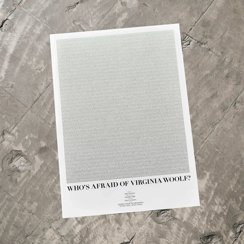 A Who's Afraid of Virginia Woolf? movie script poster laid flat on a textured floor surface.