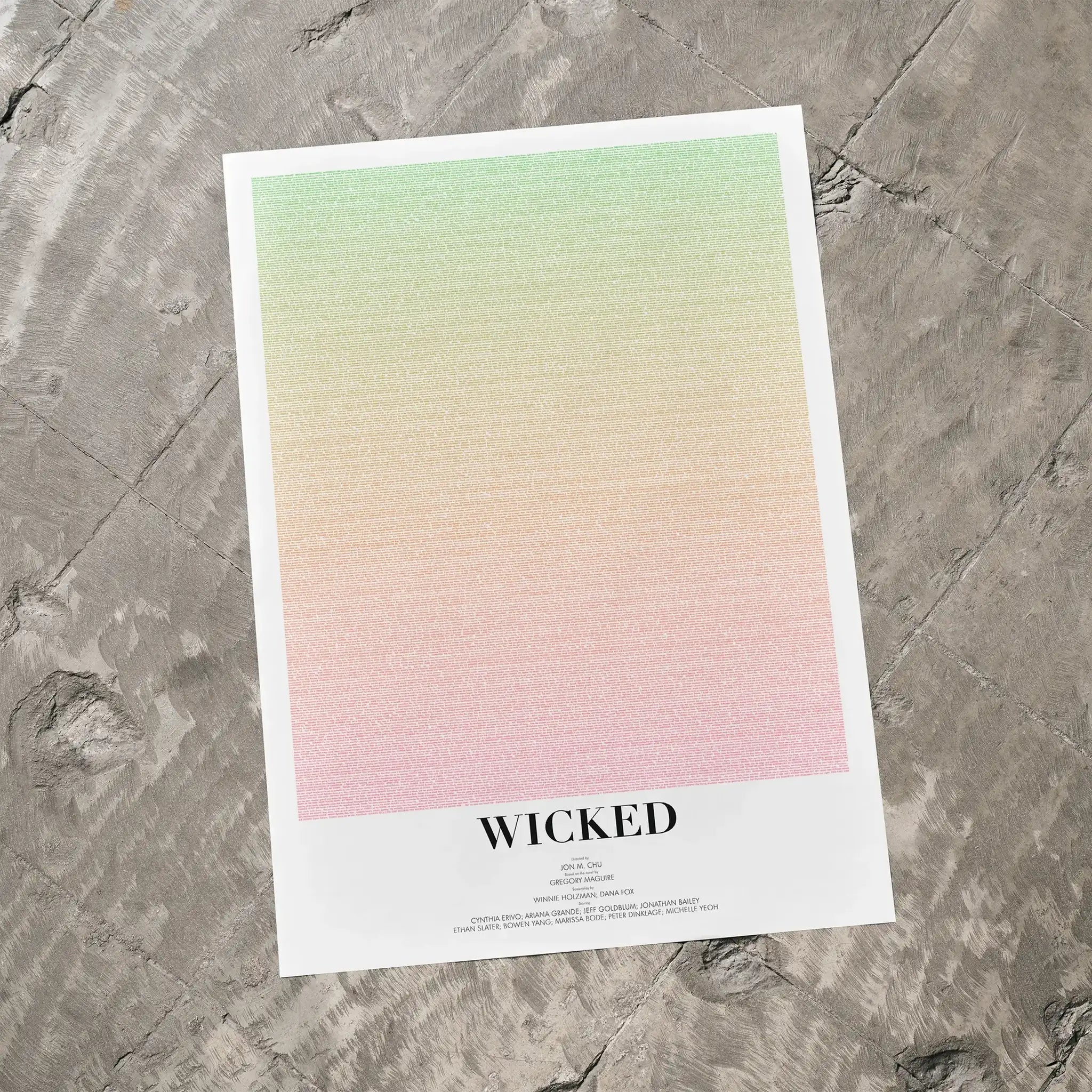 Poster with gradient design and 'Wicked' text on a textured surface