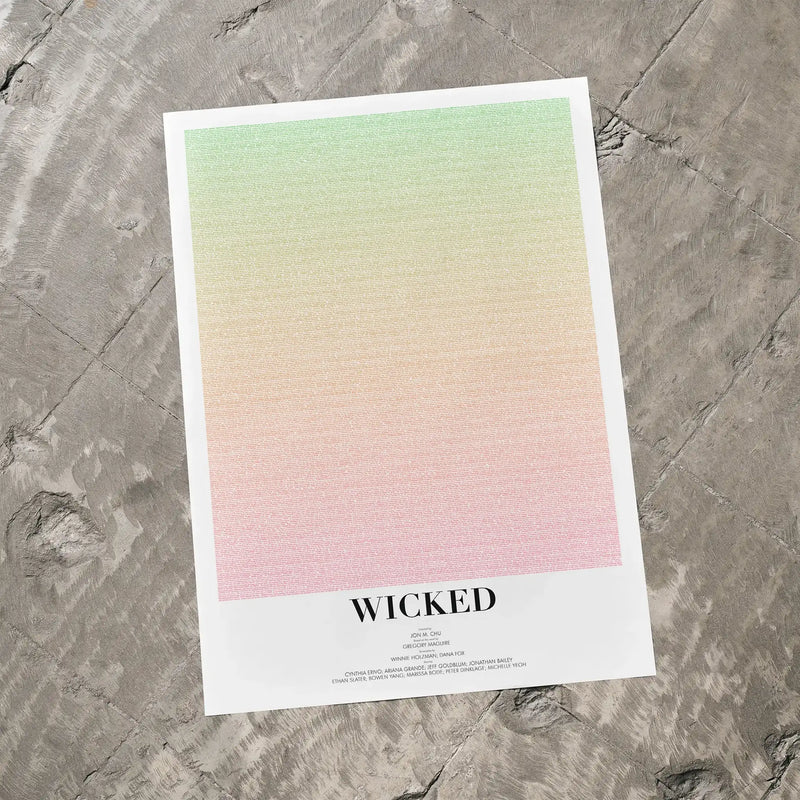 Poster with gradient design and 'Wicked' text on a textured surface