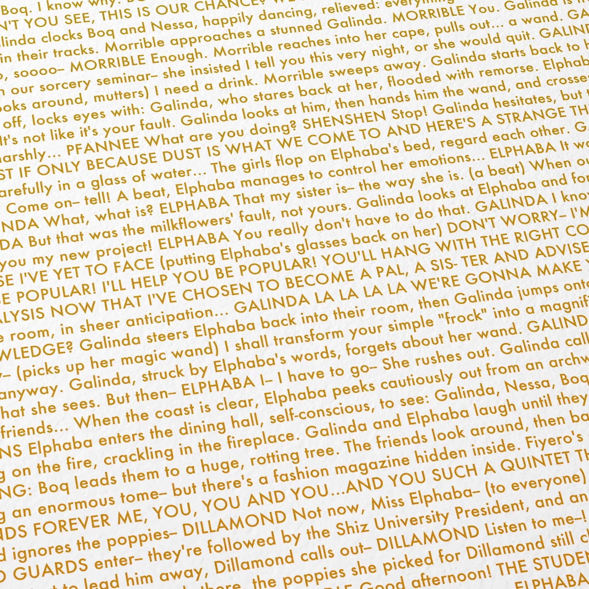 Close-up detail of the Wicked movie script poster showing dense typographic text.