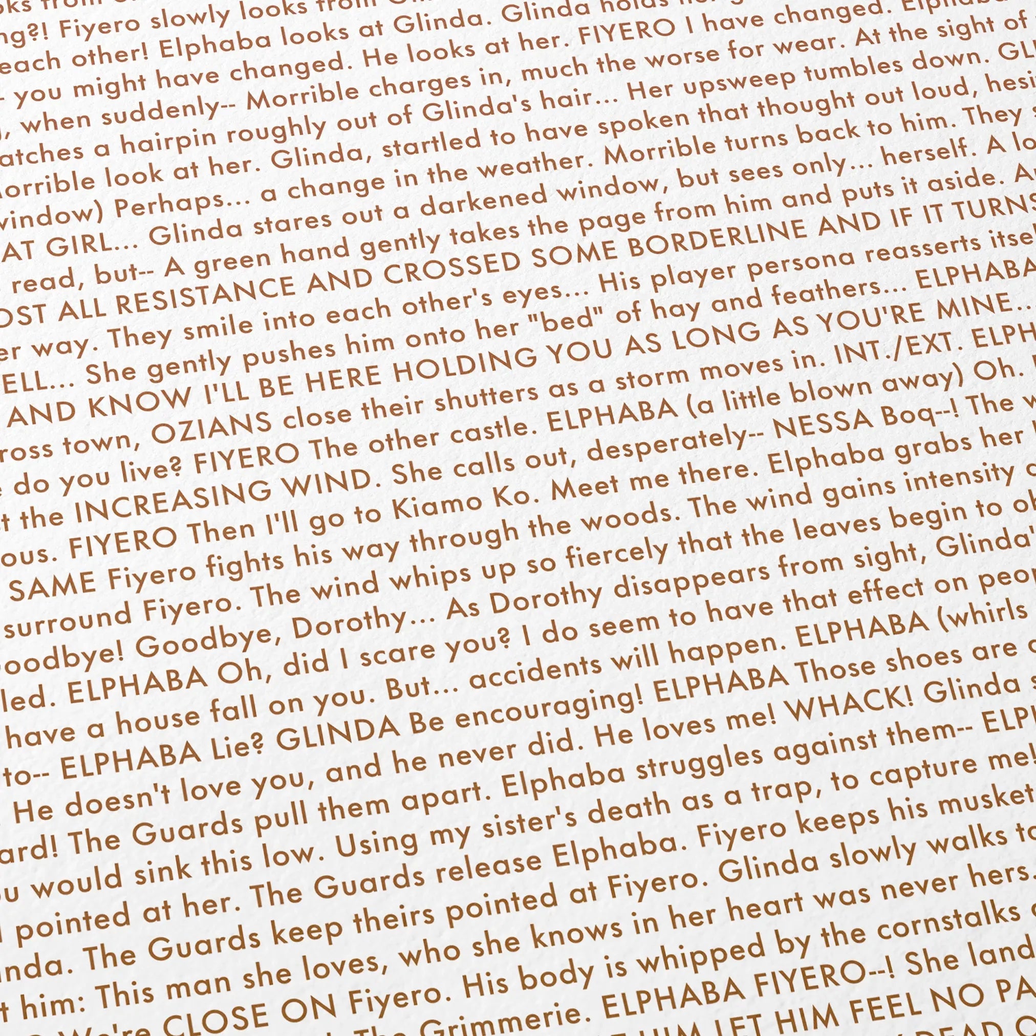 Close-up detail of the Wicked for Good movie script poster showing the screenplay  text.