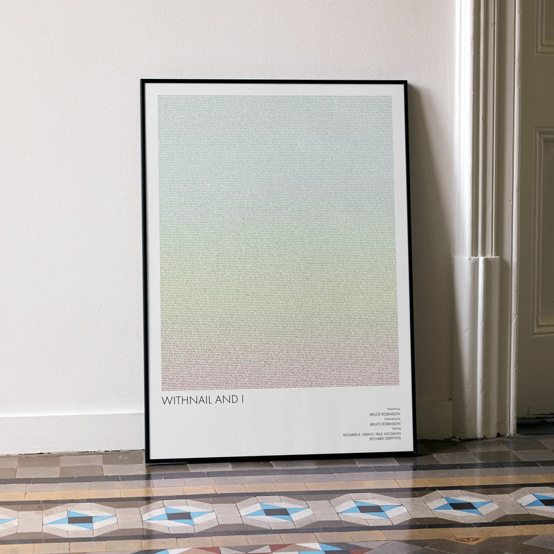 A framed Withnail & I movie script poster leaning against a wall in a minimalist interior.