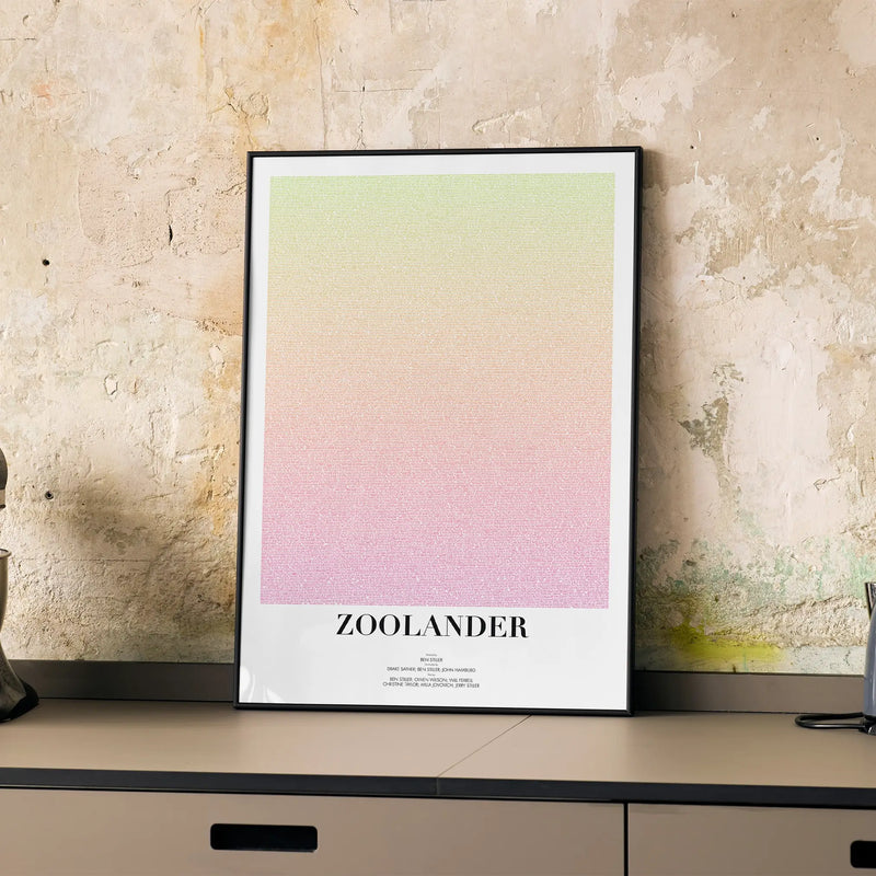 A framed Zoolander movie script poster displayed on a cabinet in a minimalist interior.